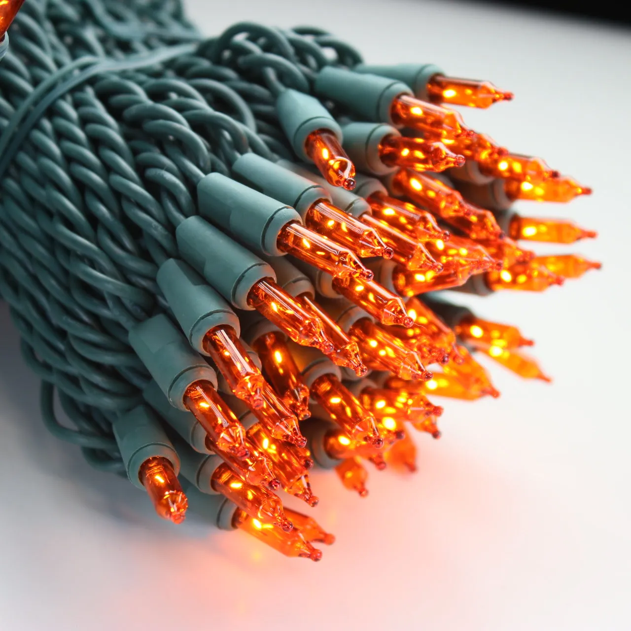 100-bulb Orange Mini Lights, 6" Spacing, Green Wire